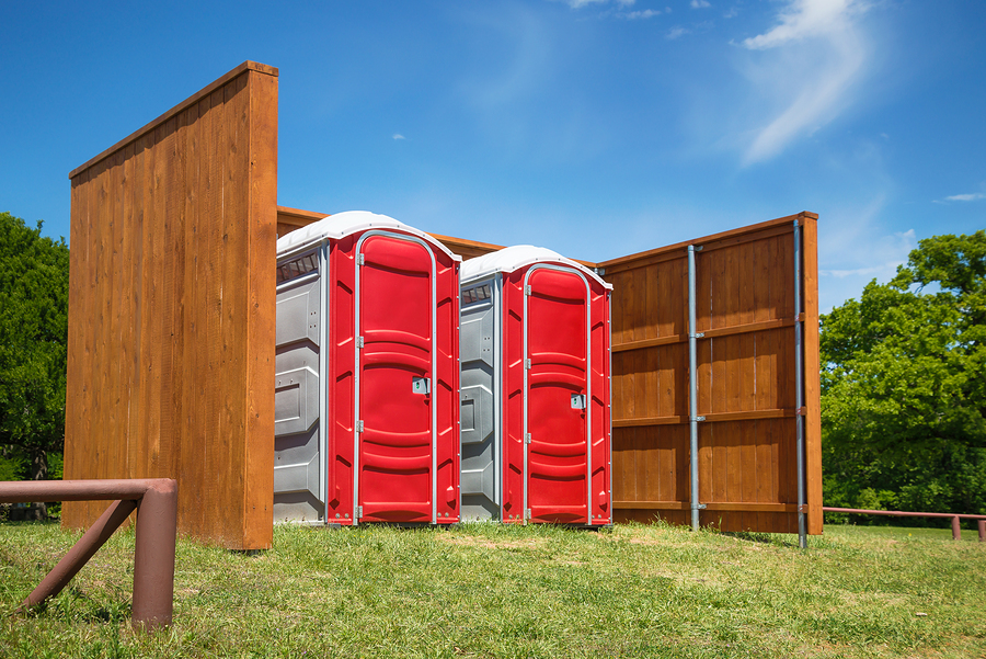 two red portable toilets